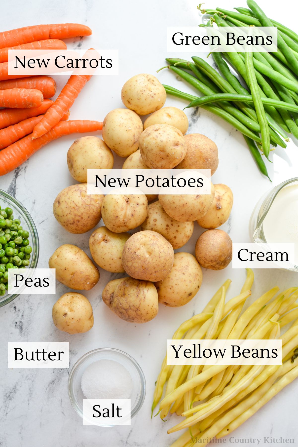The ingredients needed to make hodge podge: new potatoes, carrots, green beans, yellow beans, cream, butter, salt, and peas.