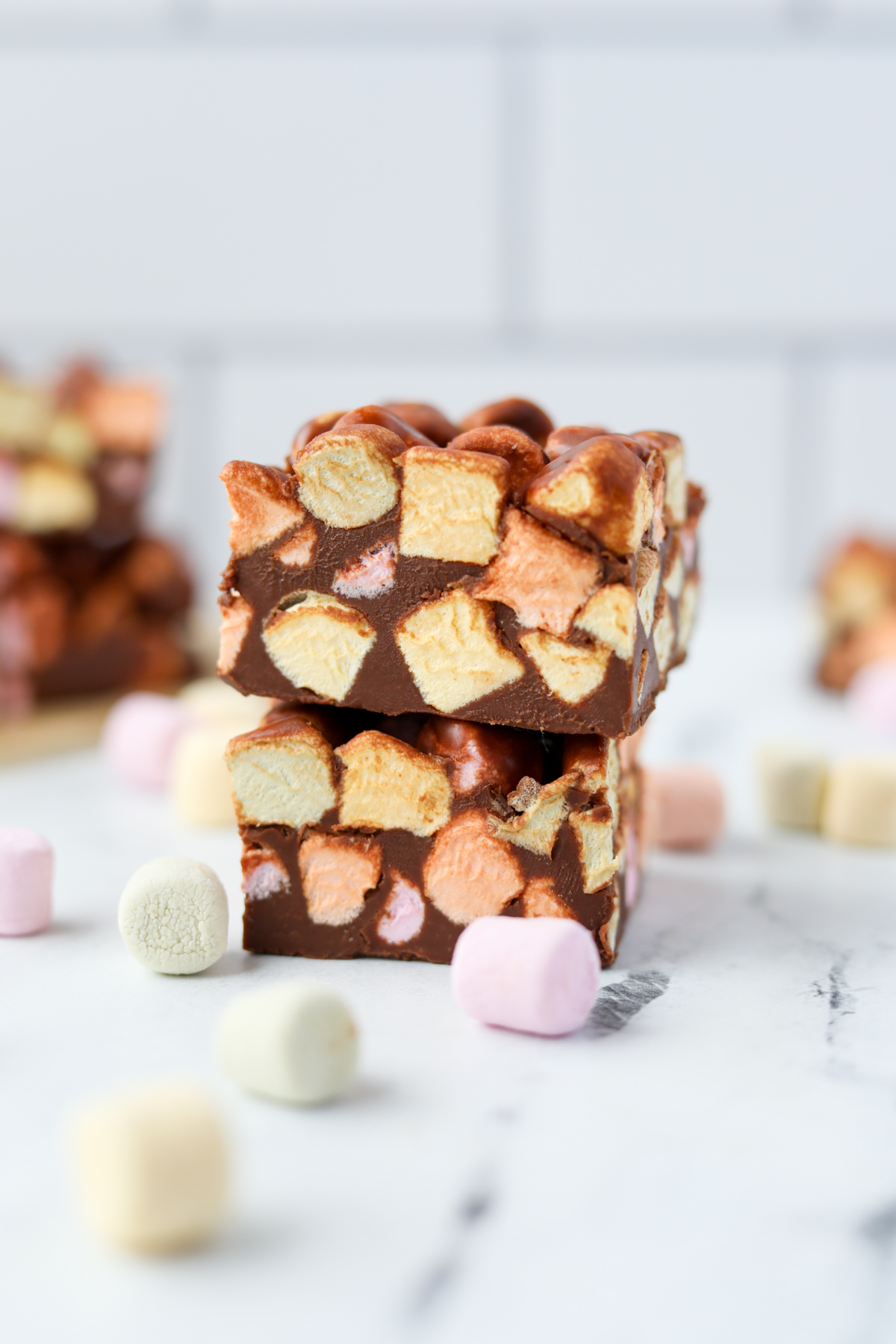 A stack of marshmallow bars on a white marble counter.