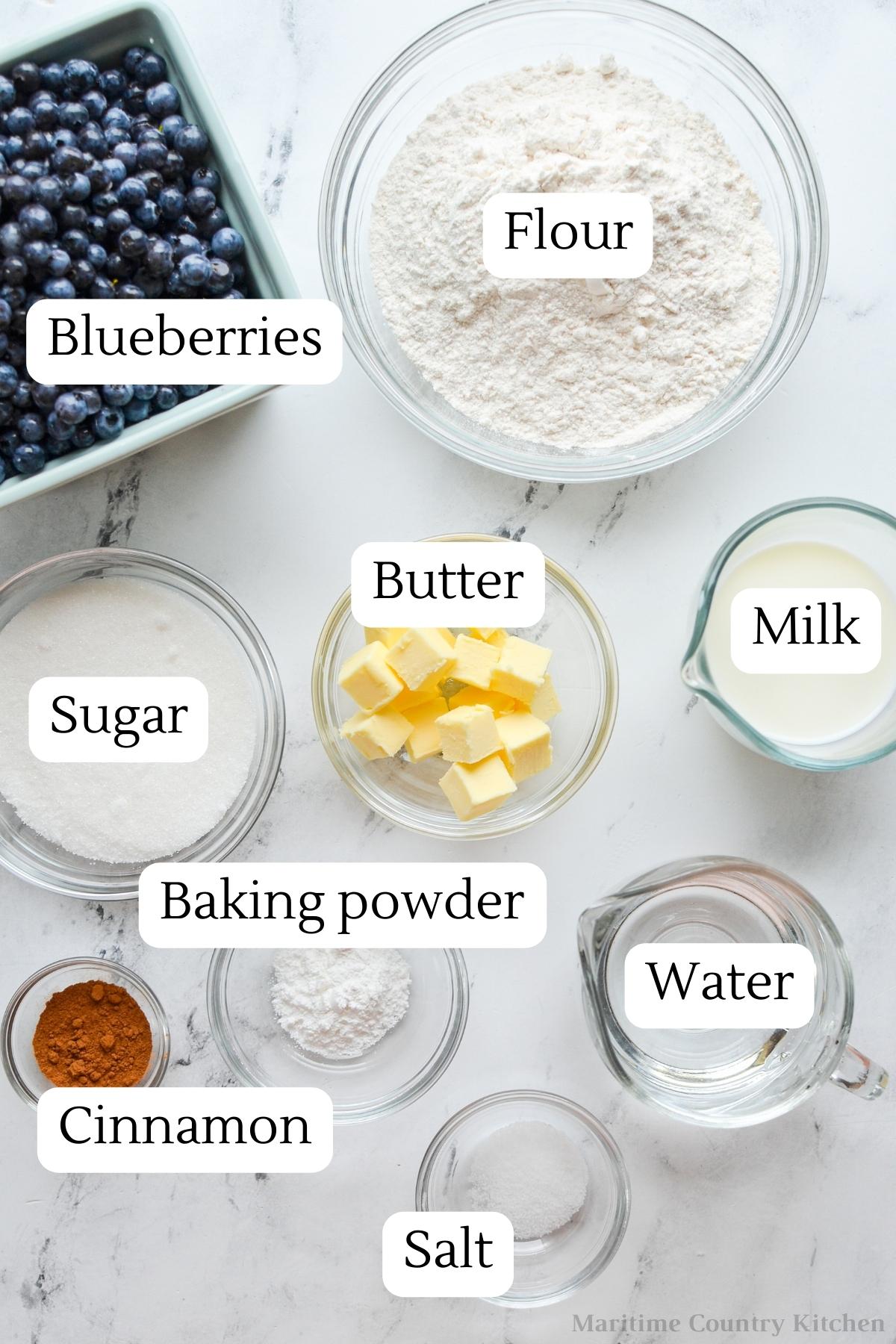 The ingredients needed to make blueberry grunt: blueberries, flour, butter, etc.