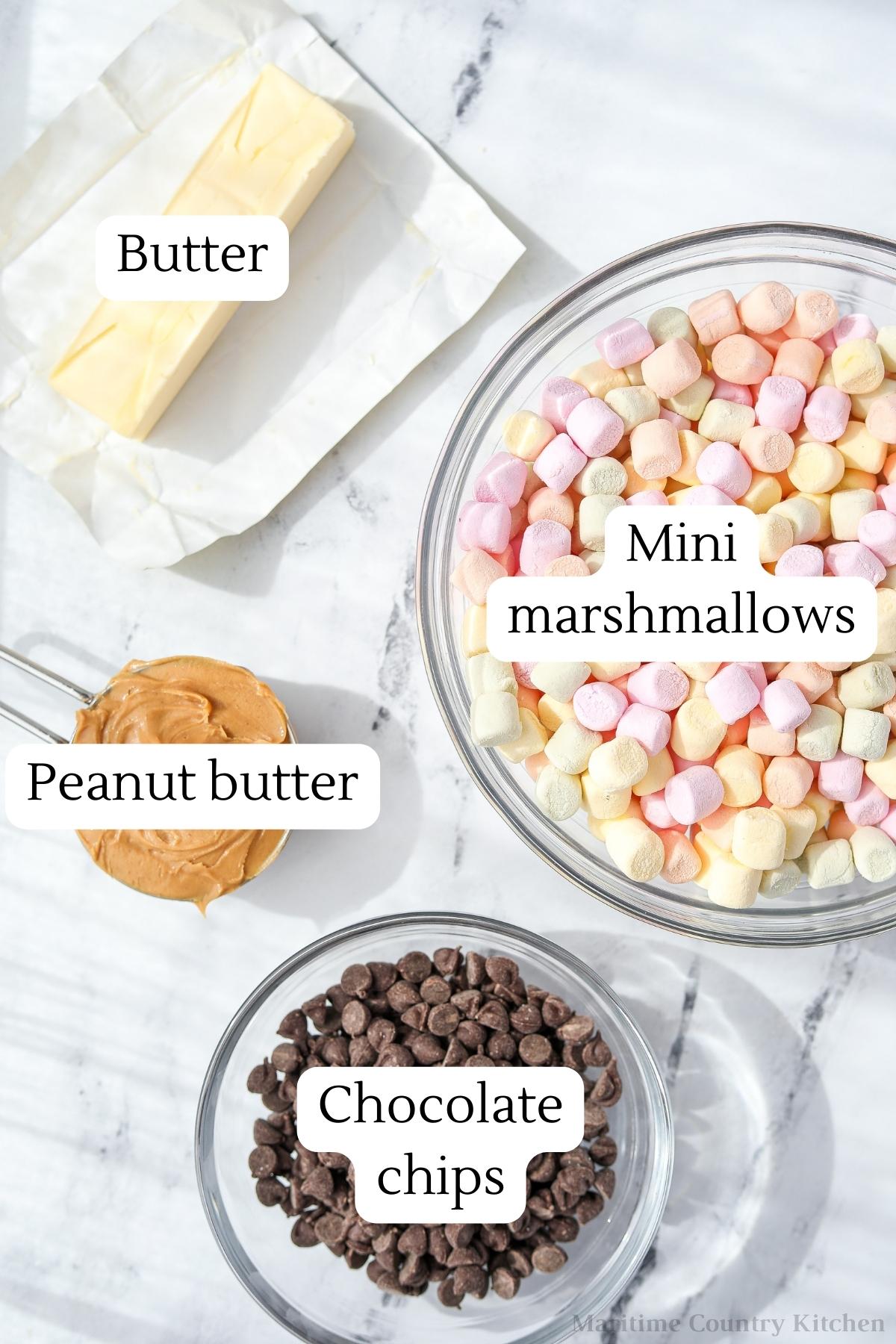The ingredients needed to make confetti bars: butter, marshmallows, peanut butter, and chocolate chips.
