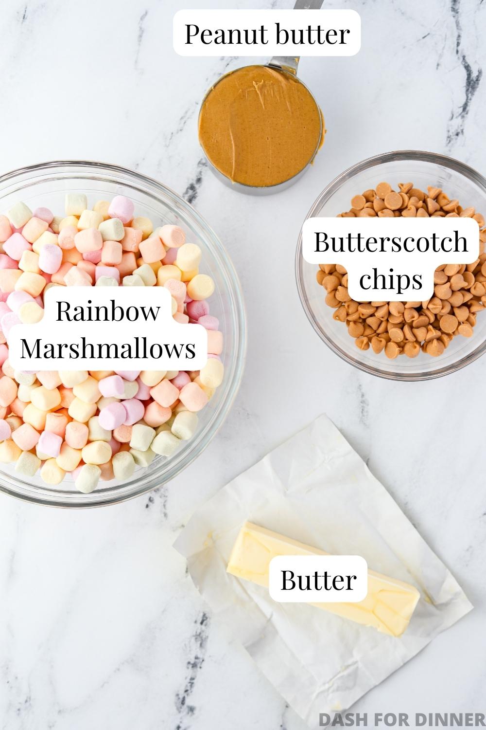 The ingredients needed to make butterscotch marshmallow bars: rainbow marshmallows, butter, peanut butter, and butterscotch chips.