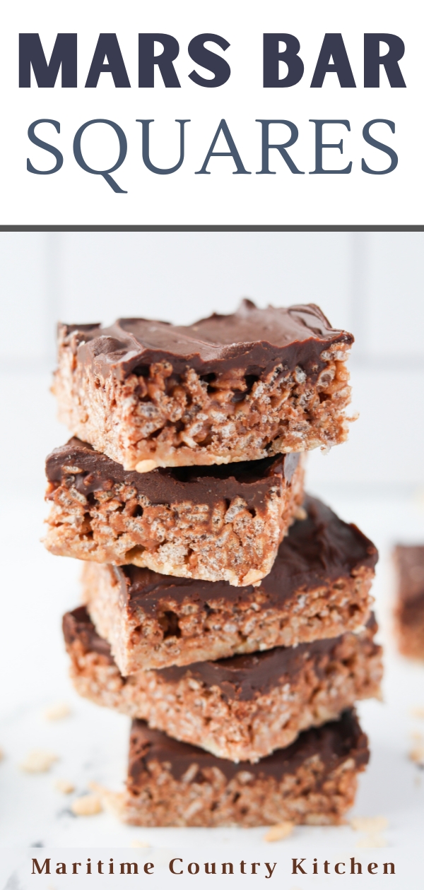 A stack of cereal bars topped with chocolate.