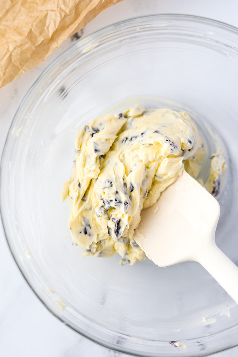 A bowl of softened butter mixed with seaweed.