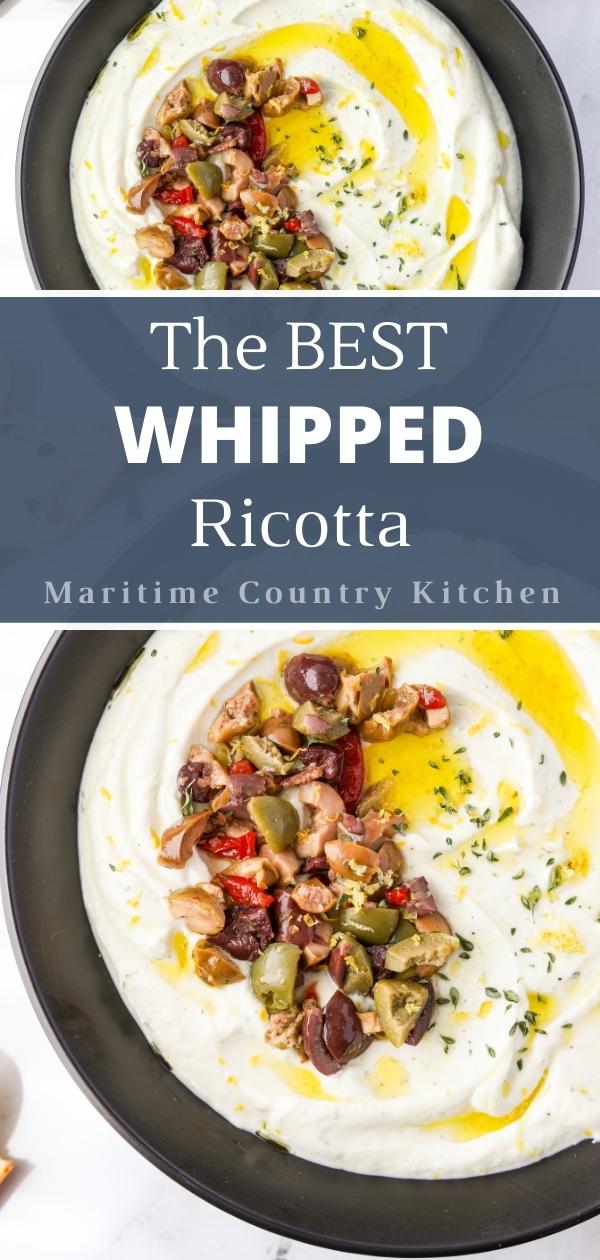 A bowl of whipped ricotta garnished with olives, olive oil, lemon zest, and herbs.