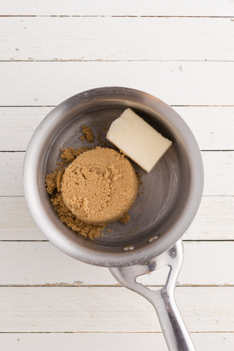 A saucepan with brown sugar and butter.
