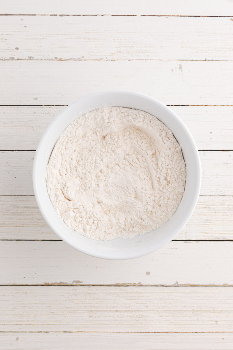Flour and other dry ingredients mixed together in a bowl.